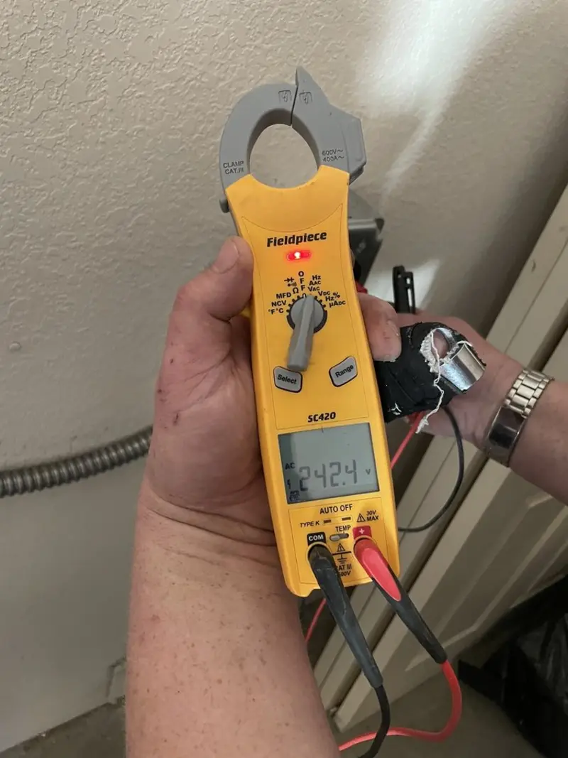 Voltage testing with clamp meter during Ceiling Fan Installation in Charlestown